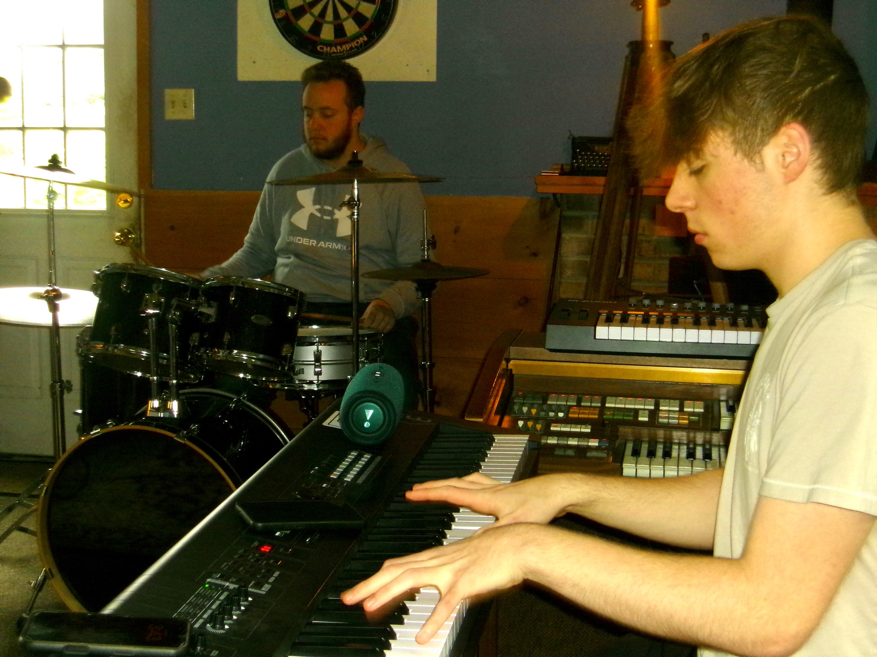 Aiden on keys and Kian on drums at practice